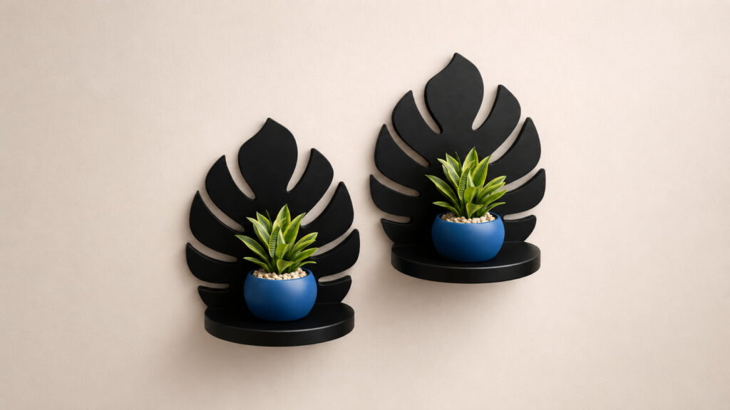 Modern black leaf wall shelf with minimalist blue plant holders on beige wall